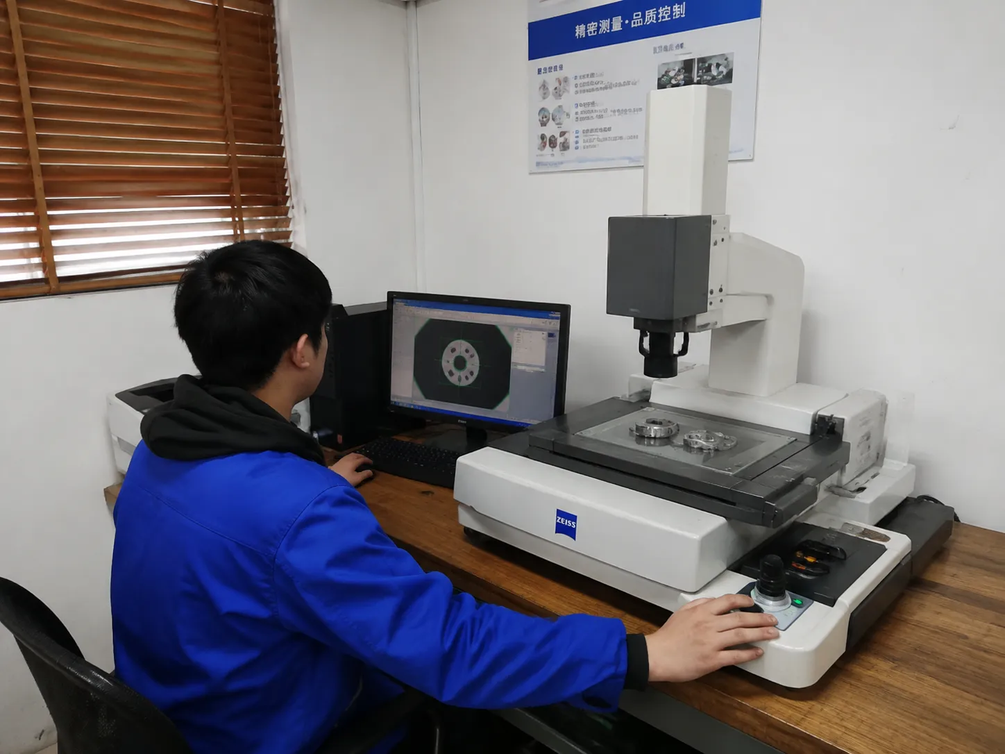 Quality Engineer performing CMM inspection on industrial shear blades